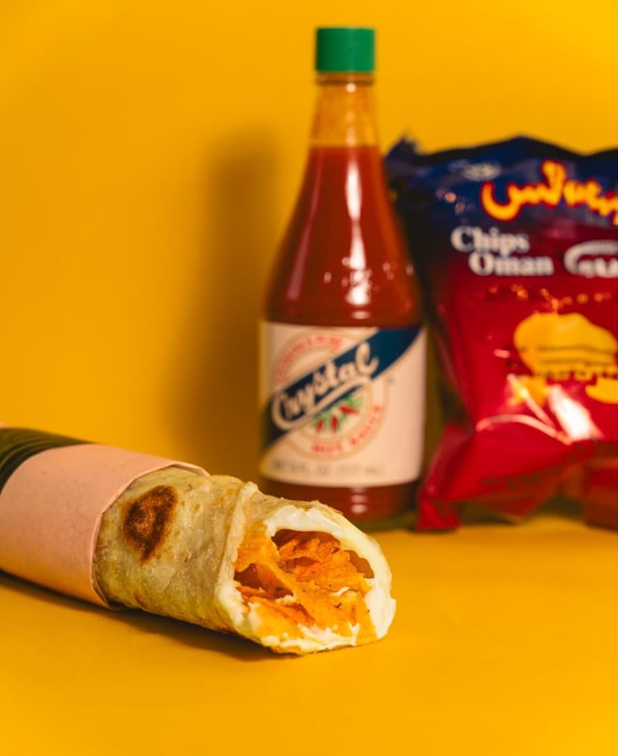 A spicy-sauce Chips Oman sandwich